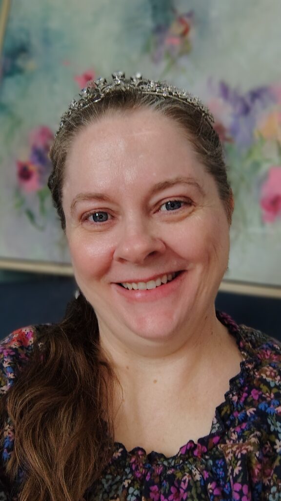 Tiaras In The Wild, photo of founder wearing a tiara and smiling