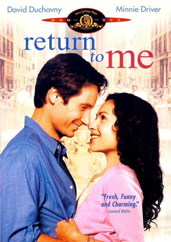 David Duchovny and Minnie Driver smiling softly. Warm, sentimental, hopeful