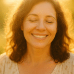 Woman reading in golden light on porch swing.