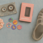 Flat lay of 80s childhood toys and accessories on a denim background
