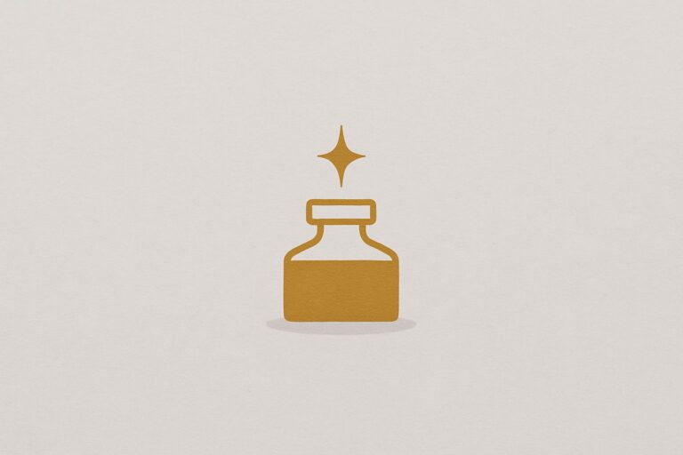 A warm-gold ink bottle with a small rising spark centered on a warm fog-gray background with a faint shadow.